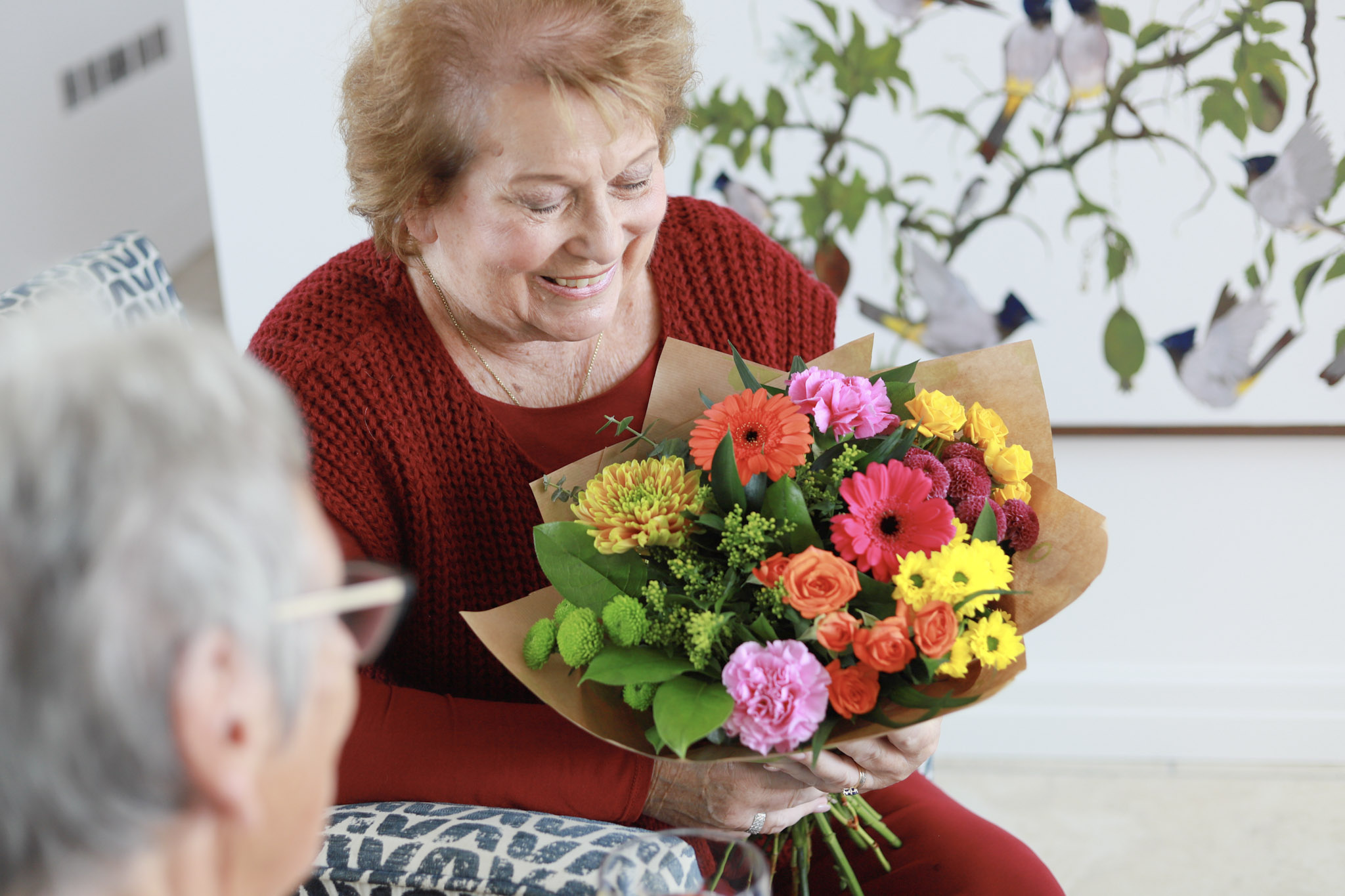 lady receives beautiful flower bouquet in malta